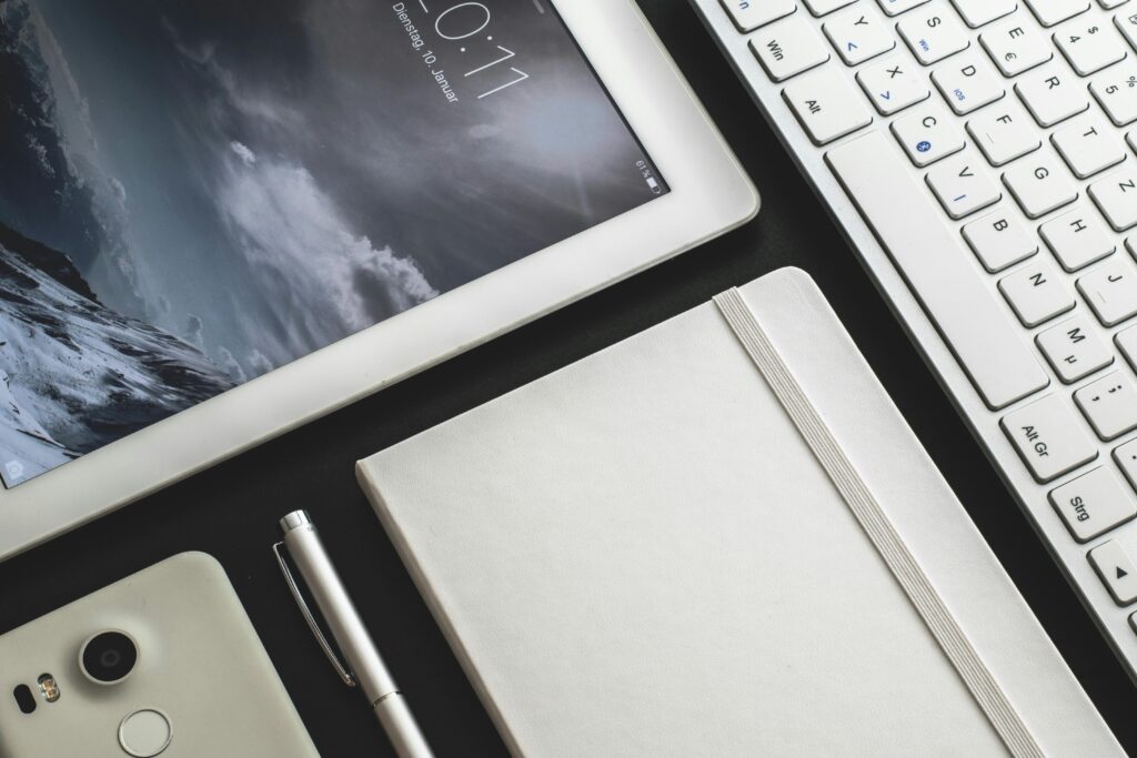 White Ipad Besides Box